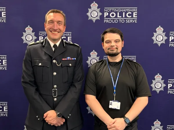 Sam, on the right, being sworn in as a police officer