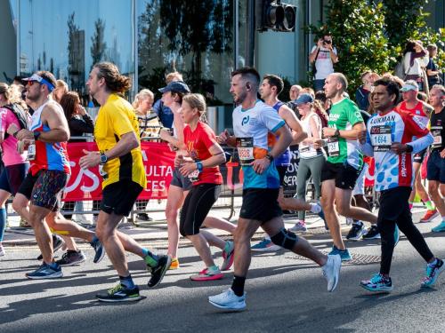 A large group of runners running the London Marathon.