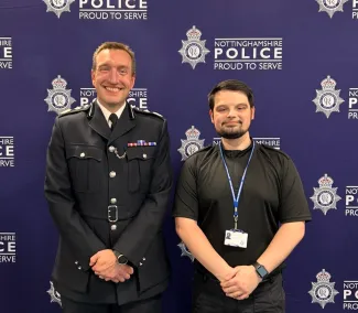 Sam, on the right, being sworn in as a police officer