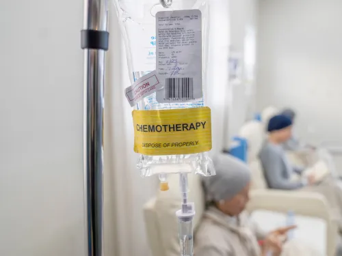 A bag off liquid hanging on a drip stand, labelled chemotherapy.