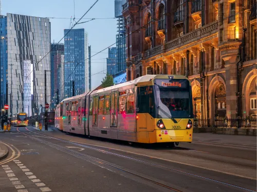 A yellow tram in Manchester city centre.