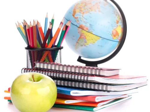 School books, globe and fruit